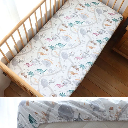 Drap-contour-lit-bébé-dinosaures-monde-a-maman