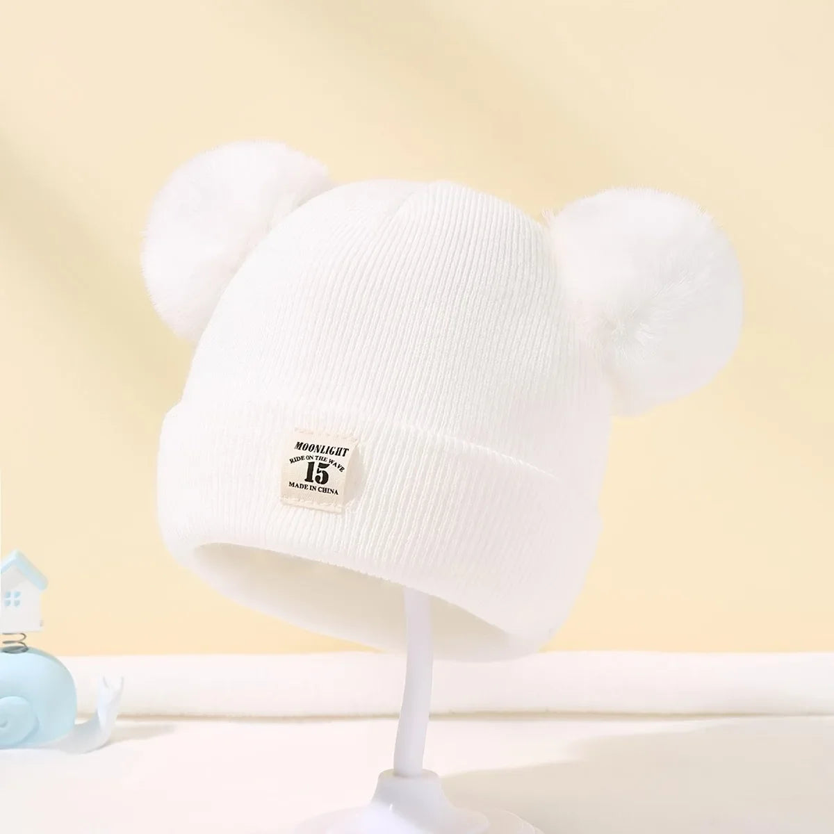 Tuque à pompons pour bébé